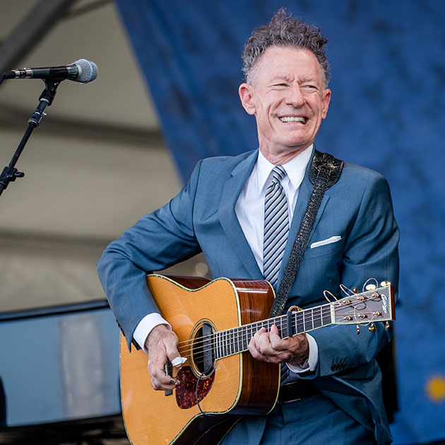 Lyle Lovett playing the guitar
