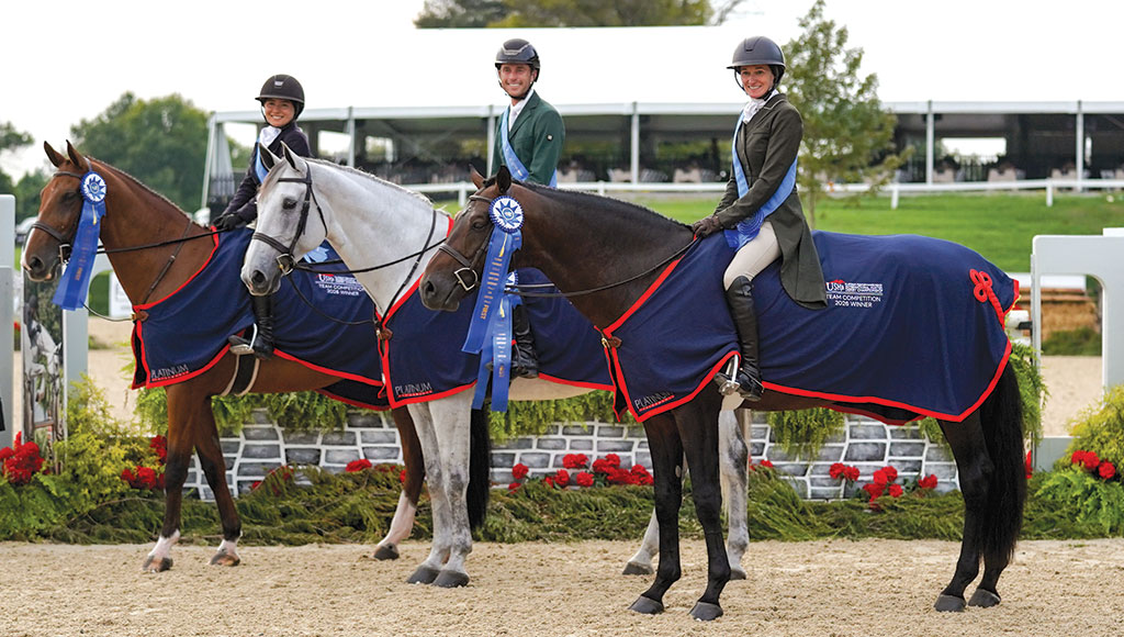 Jennifer Hannan and Cellestino jumping a hunter fence in Rolex Stadium